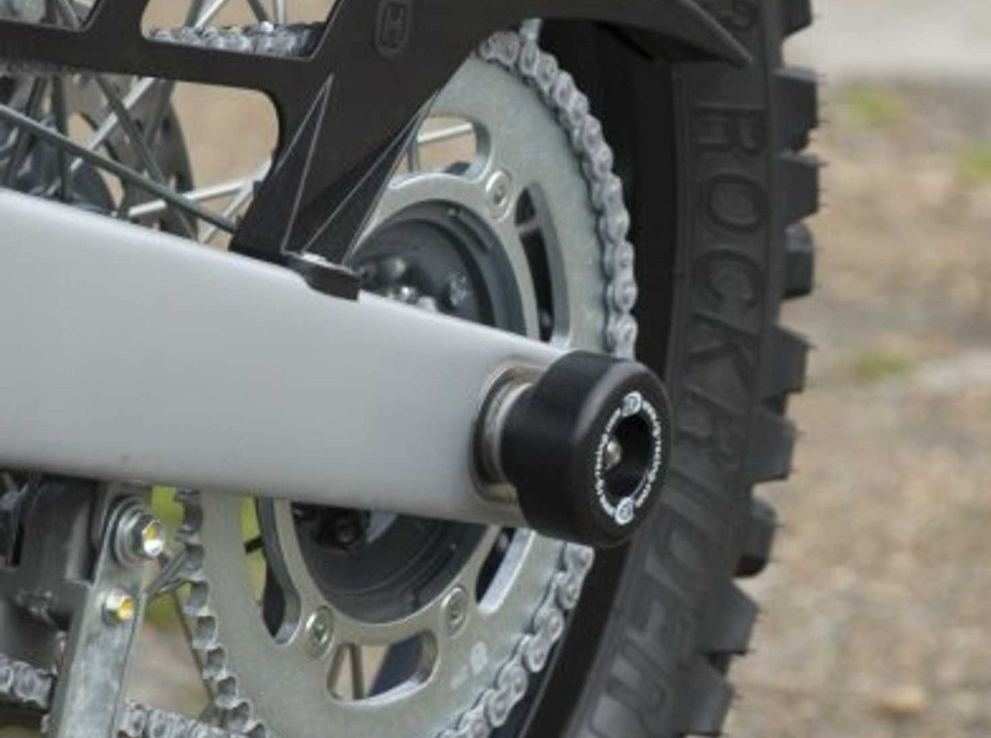 SP0042 - R&G RACING Husqvarna TE125 / SMR 630 Rear Wheel Sliders (swingarm)