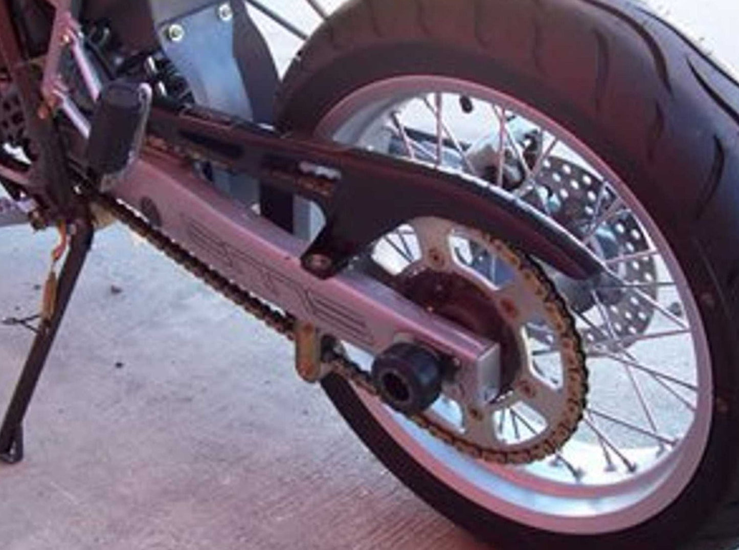 SP0009 - R&G RACING Husqvarna SM 125 / SMR 125 Rear Wheel Sliders (swingarm)