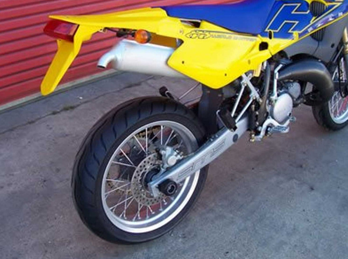 SP0009 - R&G RACING Husqvarna SM 125 / SMR 125 Rear Wheel Sliders (swingarm)